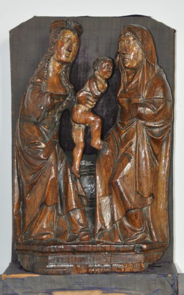 An oak sculpture depicting the Virgin and Child with Saint Anne